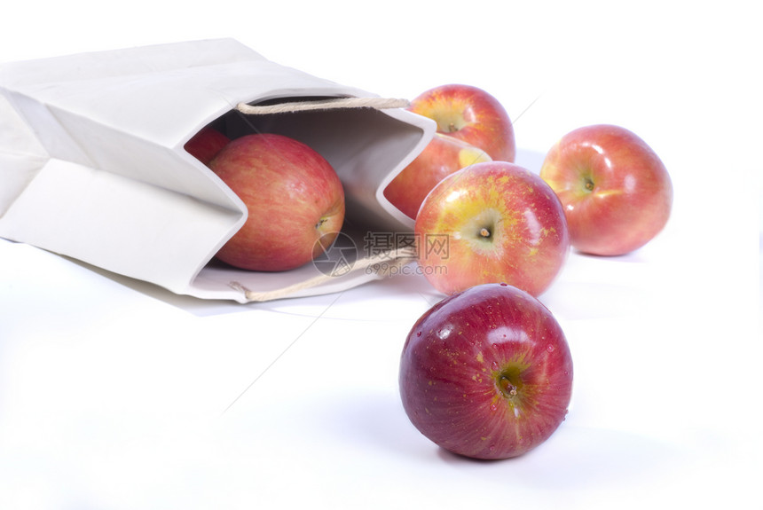 苹果从购物袋溢出图片