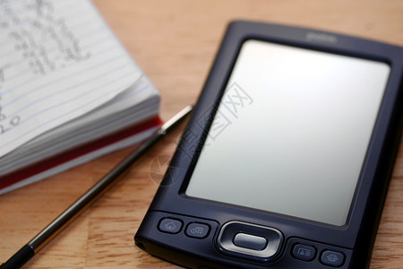 PDA 开发部商业软垫宏观电子灰色木头手写笔白色电脑记事本背景图片