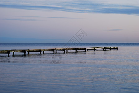 斯特普韦尔Falsterbo海滩日落蓝色天空海浪太阳黑色橙子背景