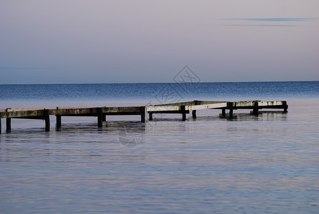 斯特普韦尔Falsterbo海滩日落黑色海浪天空橙子蓝色太阳背景