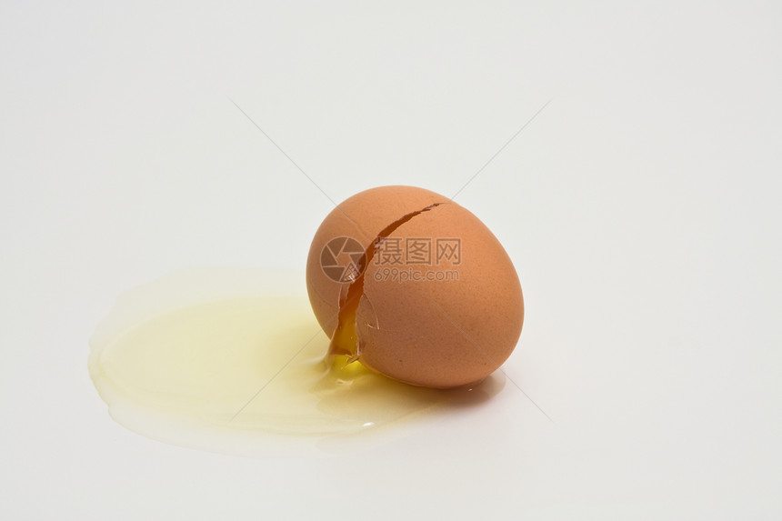 碎裂的露蛋橙子早餐蛋壳蛋黄生活奶制品母鸡烹饪营养食物图片