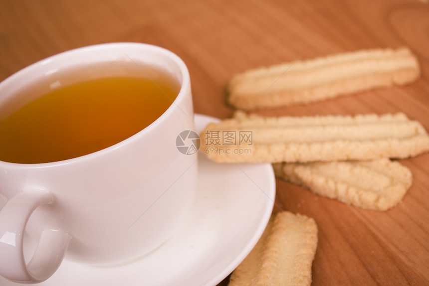 茶杯和饼干陶瓷芳香奢华小吃食物早餐勺子面包美食饮料图片