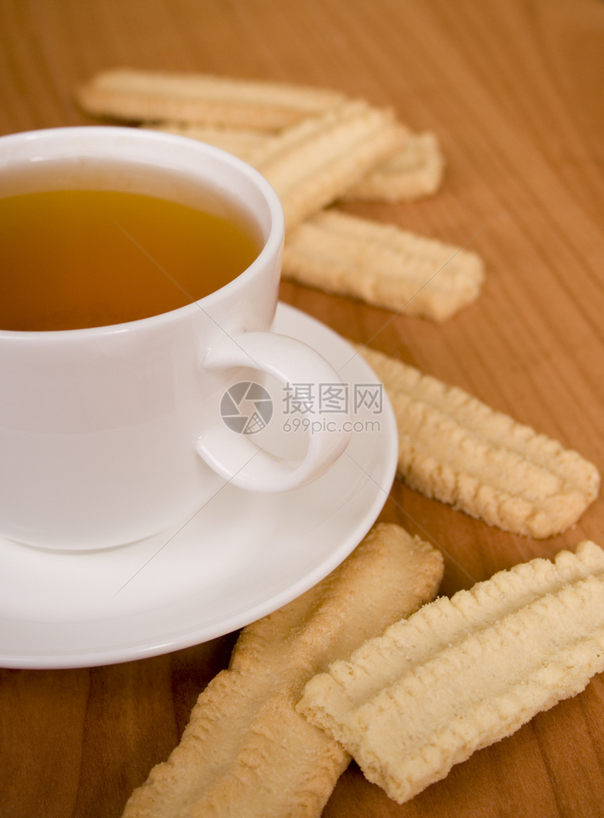 茶杯和饼干木头陶瓷飞碟小吃食物饮料芳香美食甜点勺子图片