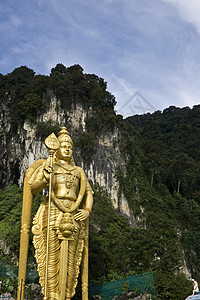金金雕像文化旅游金子旅行游客洞穴上帝纪念碑雕刻地标背景图片