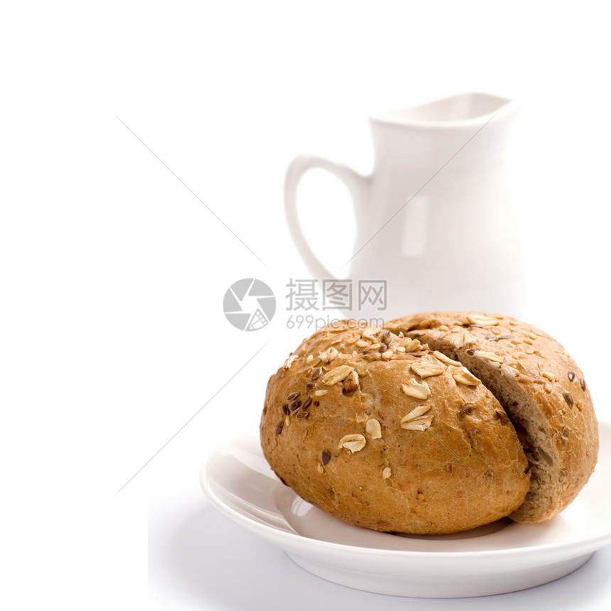 和乳汁陶瓷早餐面包小吃产品饮食棕色制品种子盘子图片