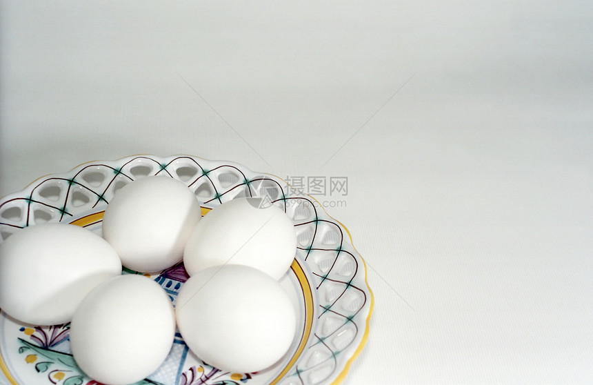 盘子上的白蛋传统厨具陶瓷宗教桌子食物制品用具装饰品文化图片