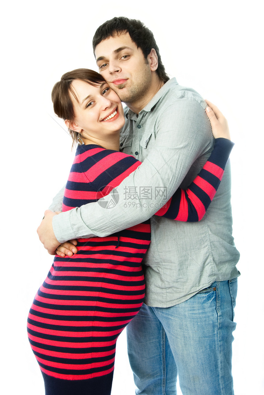 幸福的怀孕妇女及其丈夫腹部母性父亲家庭快乐母亲男人拥抱微笑女孩图片