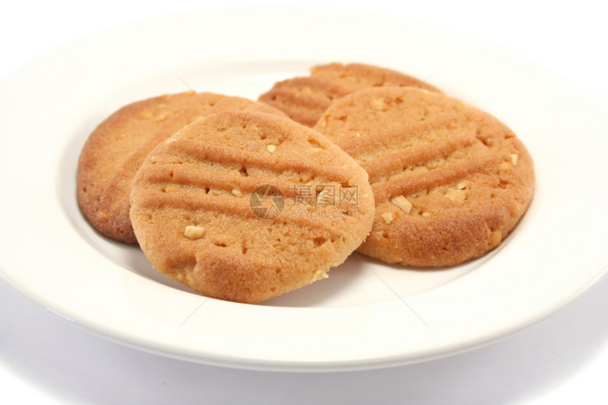 盘子上的自制饼干焙烤育肥白色食品烘烤时间小吃花生图片
