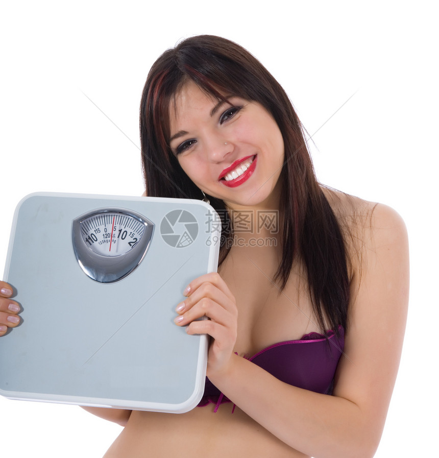 白色背景上有天秤的漂亮女孩重量营养肥胖损失运动女孩平衡图片