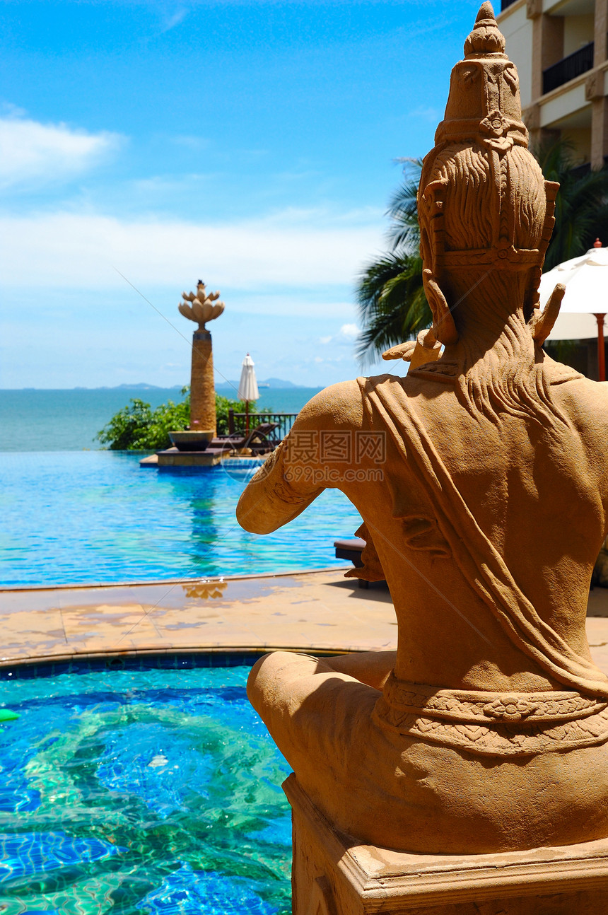 祈祷佛祖水池游客旅游假期宗教石头反射雕塑闲暇海洋图片