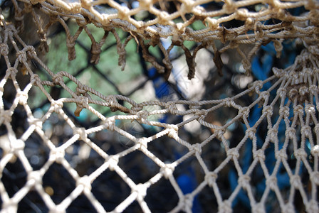 丰富多彩的渔网海洋娱乐绿色蓝色渔业闲暇运动棕色背景图片