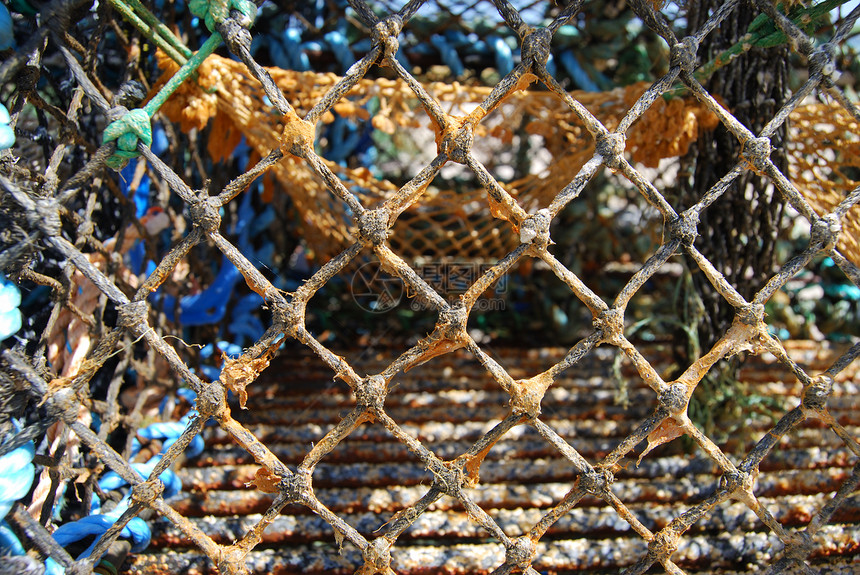 丰富多彩的渔网海洋蓝色绿色棕色闲暇娱乐渔业运动图片