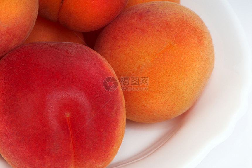 盘子里的桃子黄色果汁白色食物肉质活力美食水果早餐图片