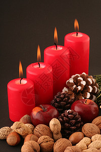 修道院黑色活动坚果蜡烛红色基督核桃维生素火焰庆祝背景图片