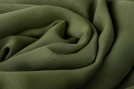 深绿色绿织物亚麻床单黑暗棕色奢华衣服帆布棉布材料背景图片
