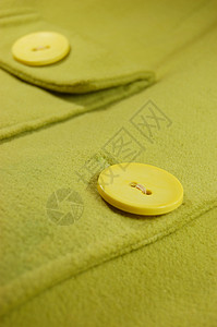 按钮键纹理黄色绿色羊毛纺织品裁缝针线活缝纫手工织物背景图片