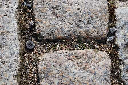 地上的按钮石头纹理灰色地面路面背景图片