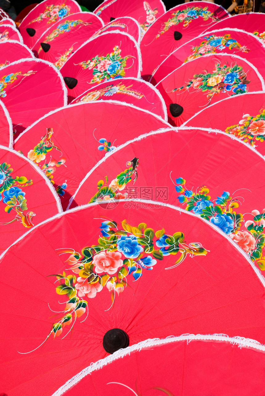 泰国的粉红色手漆雨伞织物手工业红色文化旅游节日棉布手工艺术粉色图片