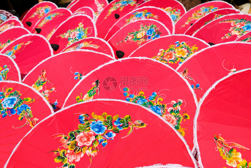 泰国的粉红色手漆雨伞文化纪念品旅游手工业手工粉色节日棉布艺术织物图片