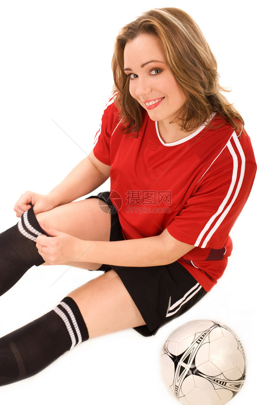 穿足球制服的年轻妇女图片
