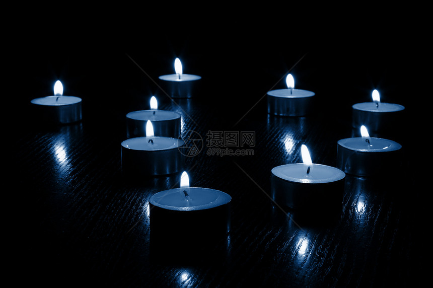 蜡烛烛光黄色黑色温泉火焰宏观宗教图片