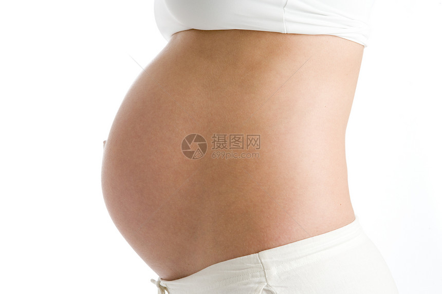 孕妇的肚子暴露了准妈妈家长水平微笑待产裁剪影棚腹部孕妇装女子图片