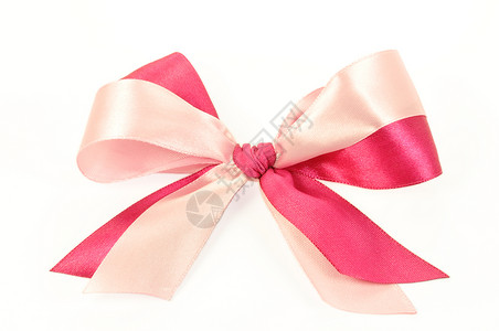 由粉红丝带制成的弓颜色丝带领带装饰品粉色包装礼品白色背景图片