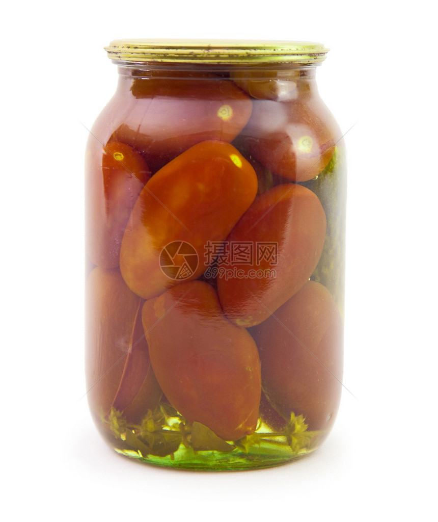 白底隔绝的玻璃罐中的西红柿图片