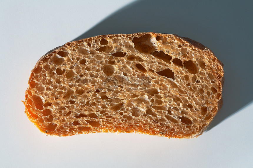 齐亚巴塔的切片小麦白色纤维面团面包化合物面粉棕色饮食美食图片