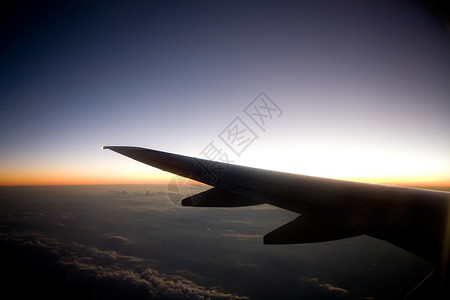 日落飞机商业飞机客机天空空气日落红眼睛翅膀橙子喷射背景图片