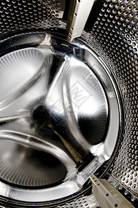 洗衣机内机器圆形金属圆圈器具合金黑色工业洗衣店背景图片