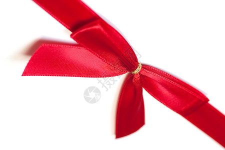 白色背景上的红丝弓丝绸红色背景图片