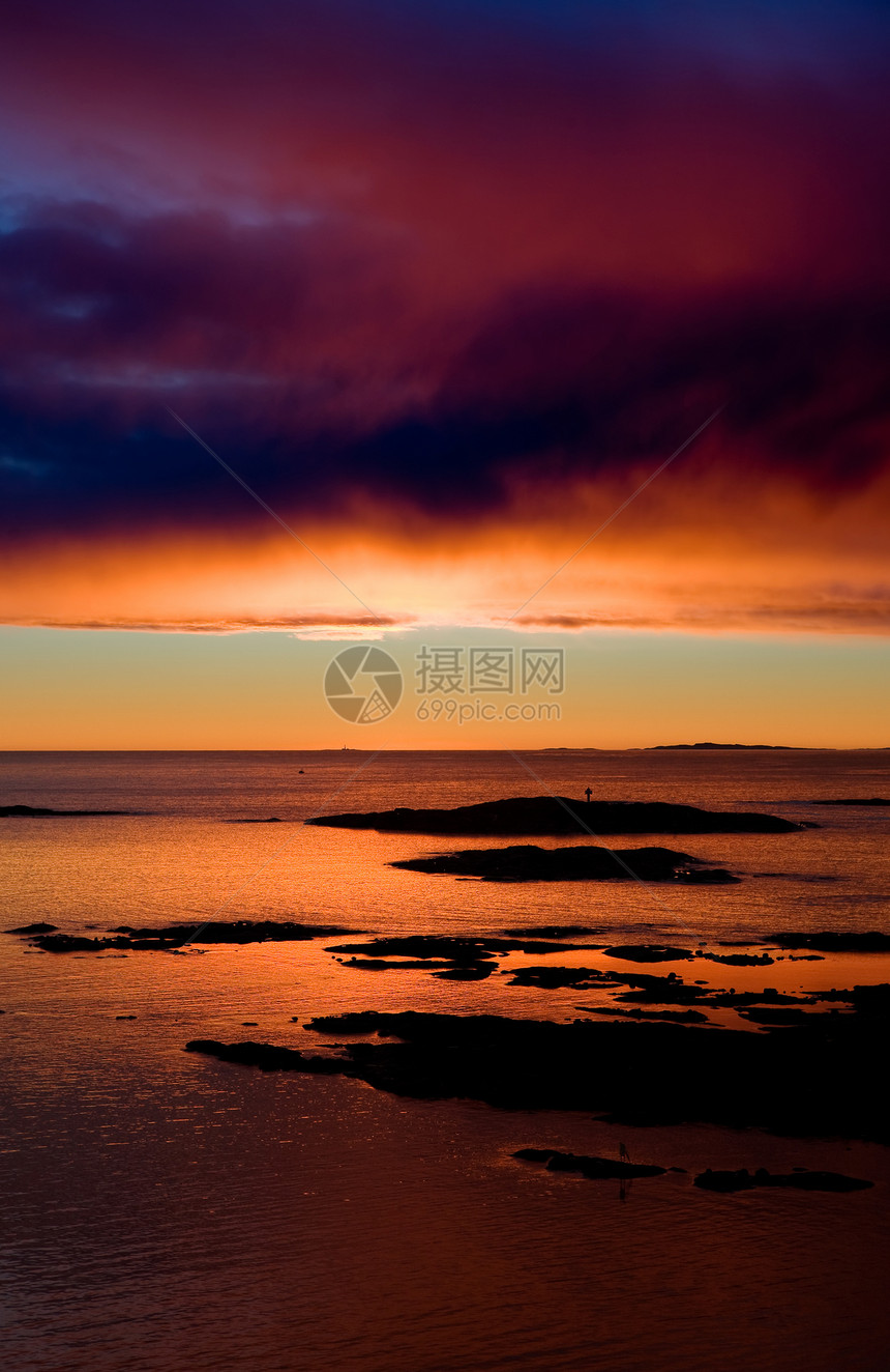 海洋日落地平线天空太阳冻结力量海景橙子蓝色岩石峡湾图片