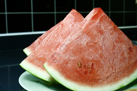 西瓜冰块种子绿色黑色食物热带营养红色冰镇皮肤背景图片