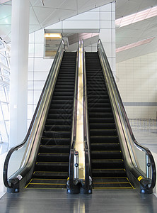 黑色扶梯技术地面楼梯运动脚步自动扶梯行动飞机场机件垂直背景图片