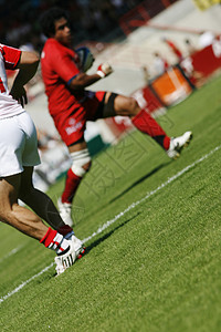 橄榄球运动员球员胜利团体团队挑战椭圆形气球游戏体育场背景图片