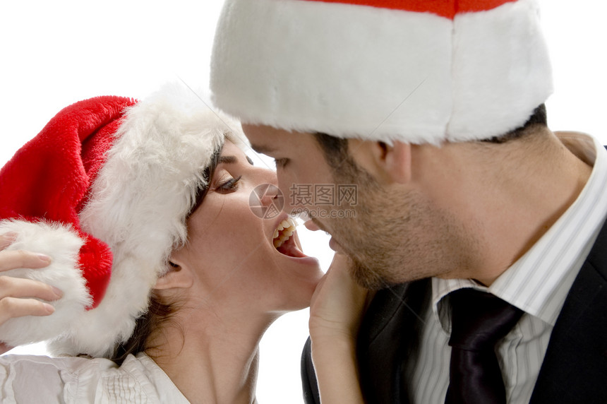 夫妻亲吻和穿着圣诞帽图片