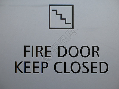 防火门关上标志安全灰色楼梯字母黑色警告背景图片