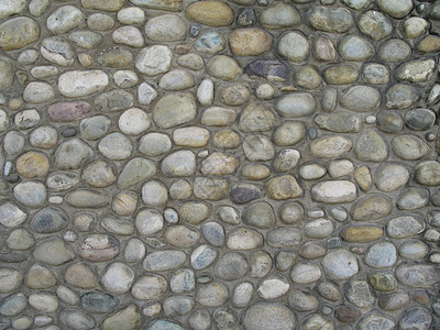 灰石墙壁背景水泥砂浆岩石建筑房子建筑学圆形石头崎岖背景图片