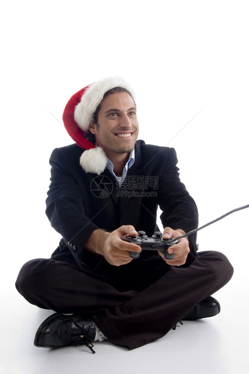 年青的美国执行官 在圣诞节帽子玩视频游戏图片