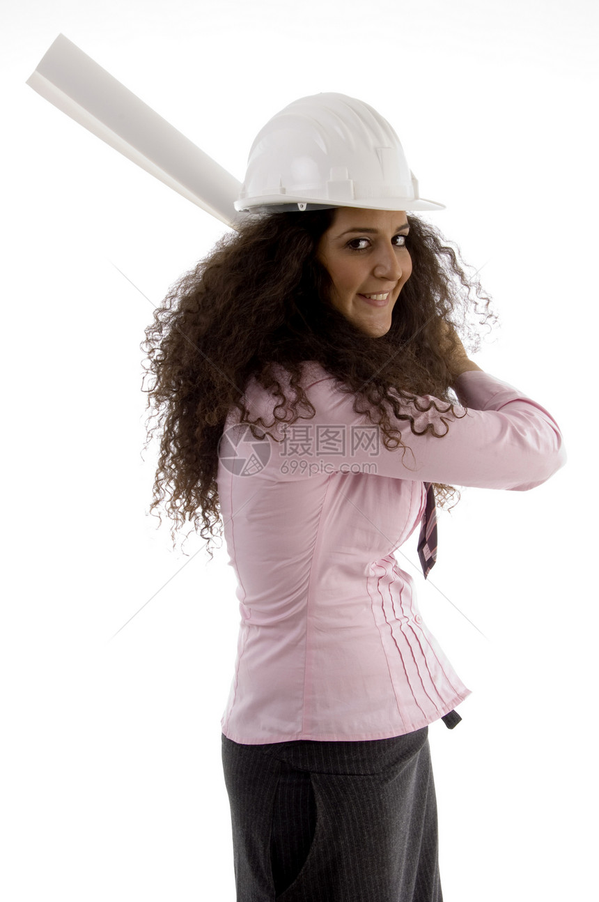 年轻的西班牙裔女性建筑师公司成人头盔建设者白色蓝图工作室衣服冒充安全帽图片