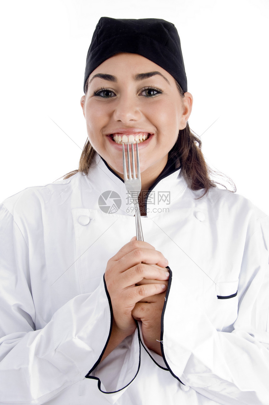 露出叉子的笑着女厨师图片