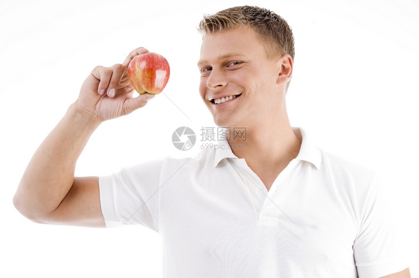 男人拿着苹果笑着微笑图片