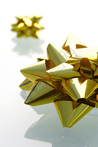 礼品包装展示金子工艺生日星星白色配件庆典丝带季节背景图片