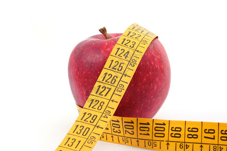 苹果和白色的测量胶带损失活力食物重量红色饮食水果磁带减肥腰部背景图片