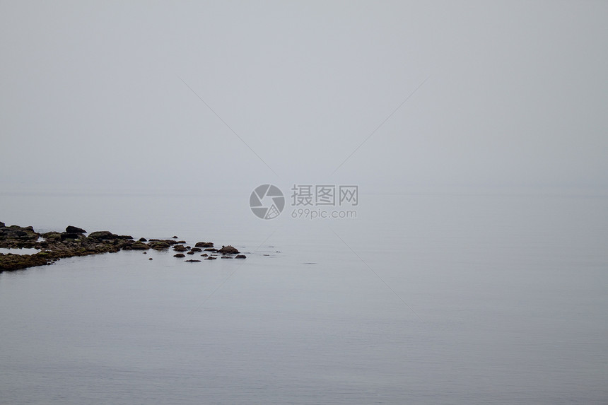 白天空 死平静海天空地平线海洋岩石海岸白色波沙黄色绿色支撑图片