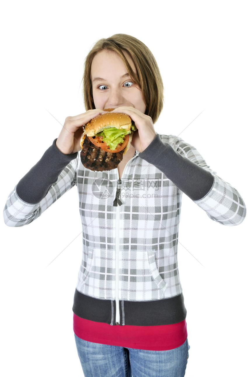 青少年女孩吃大汉堡包青年食物午餐脂肪营养油炸女孩们微笑炙烤女性图片