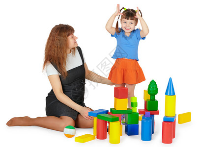 玩具塔母亲和女儿玩彩色块游戏背景