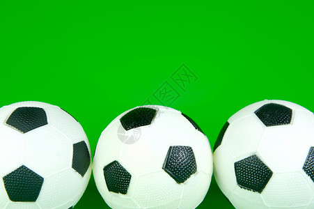 足球球孩子们沥青游戏玩具绿色孩子白色运动背景图片