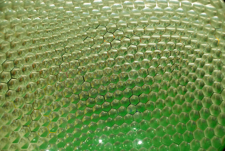 玻璃背景绿色六边形反射背景图片